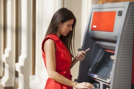 Asian lady at atm machine